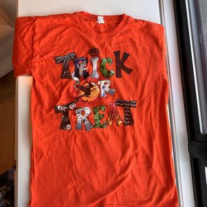Vintage Women's Halloween Trick or Treat Orange Tshirt in Size Medium